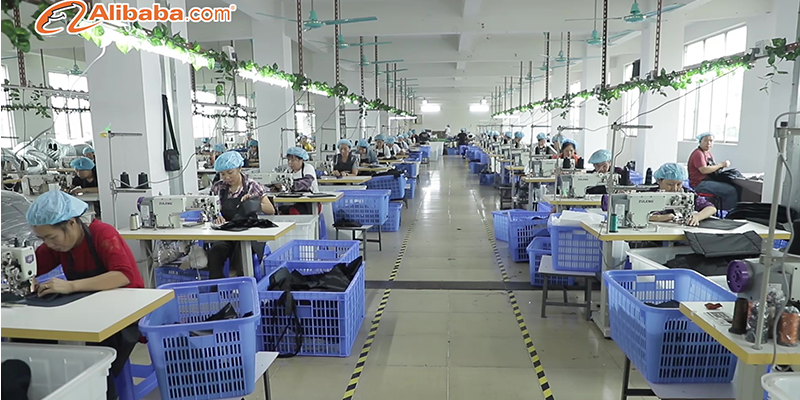 Cosmetic bag factory production line in China with skilled workers sewing bags
